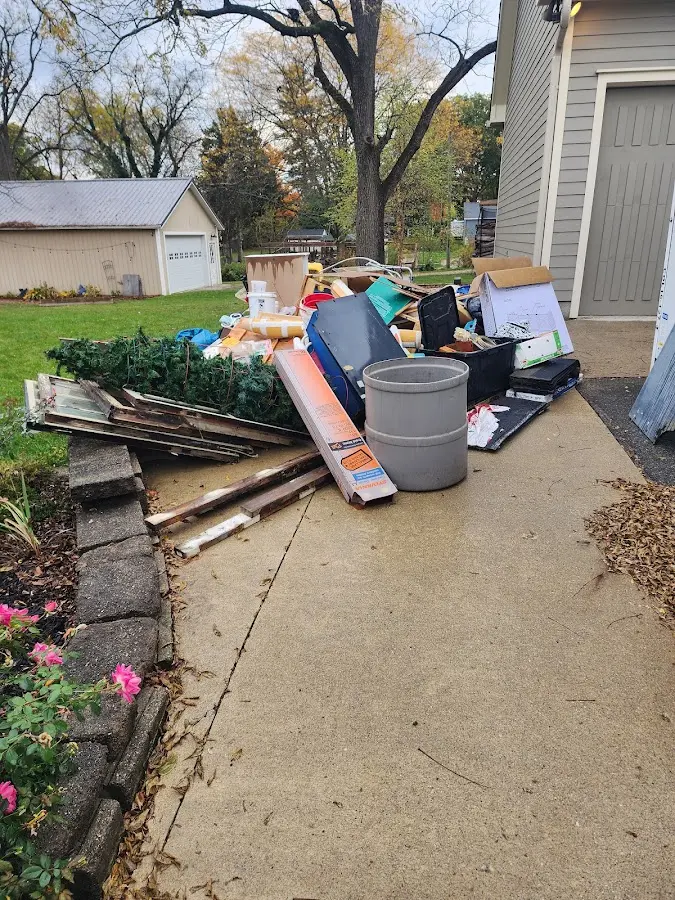 Dumpster being loaded with debris for 30 Yard Dumpster Rental in Mountain Home
